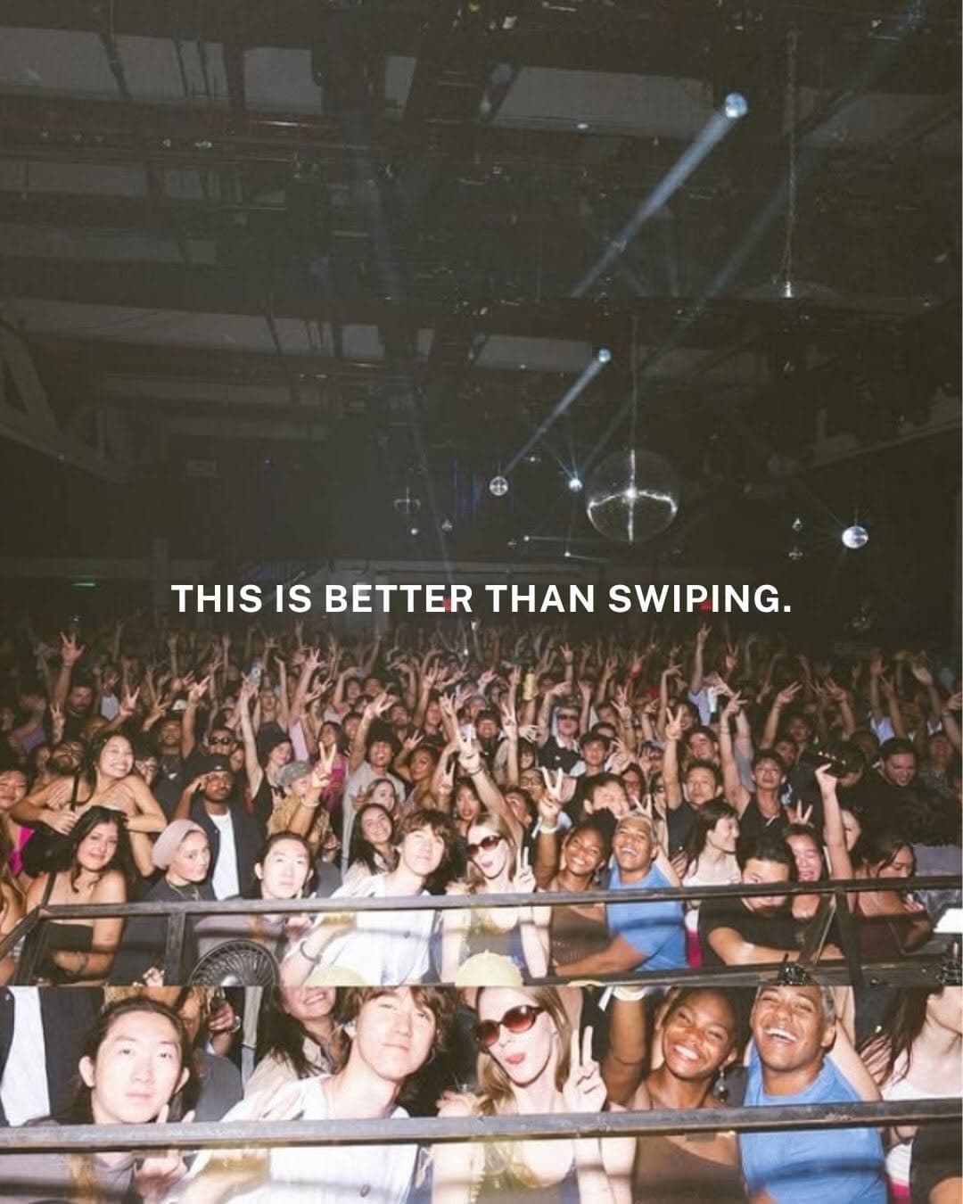 People gathered at a 2 Degrees NYC social event in an indoor venue with ambient lighting, connecting and socializing in person